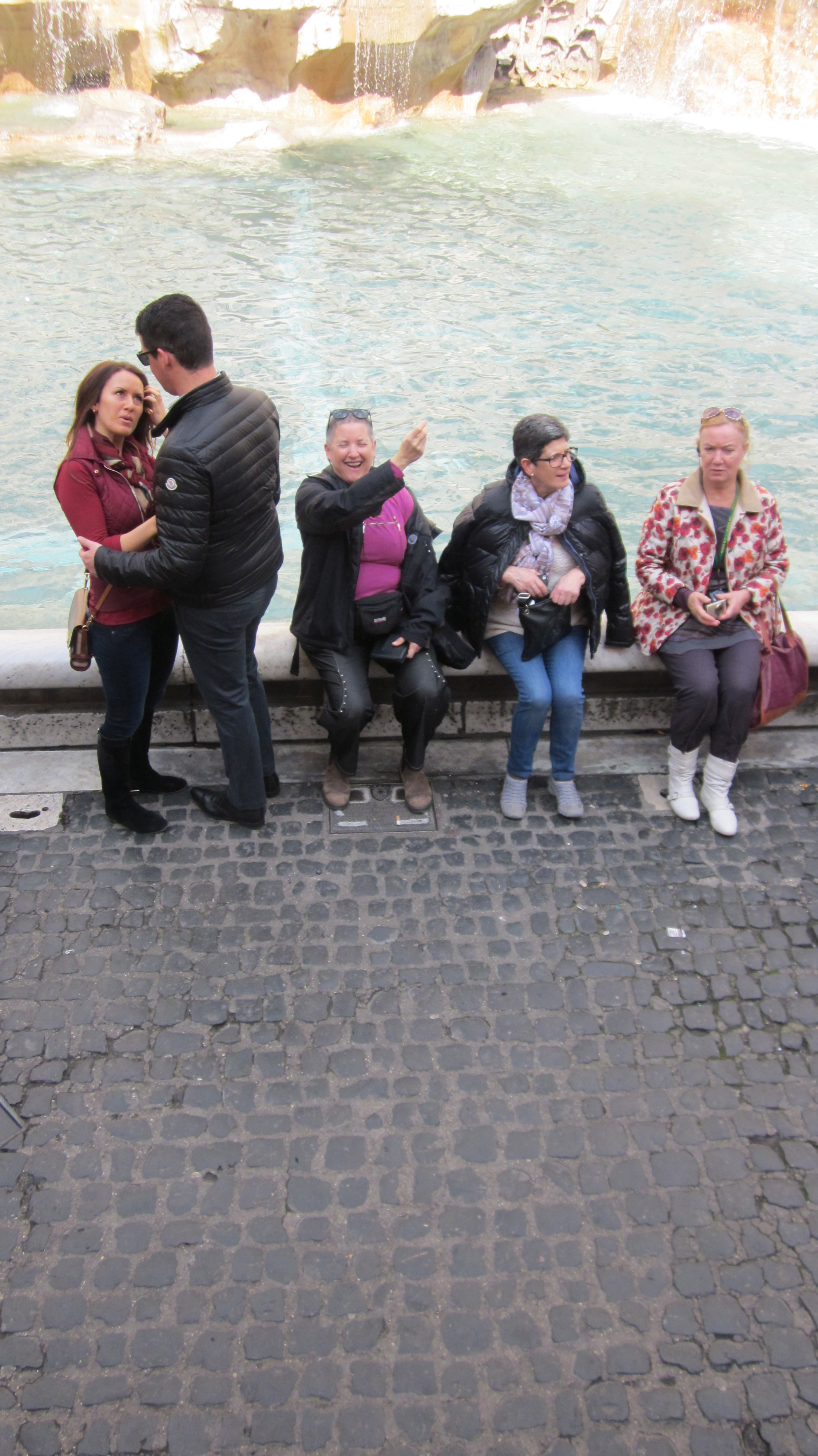 Throwing a Coin in Trevi Fountain